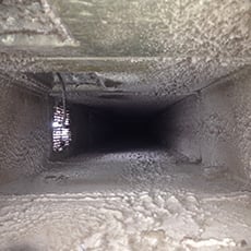 Clean air duct that reveals to show how much dirt and debris was in it before cleaning